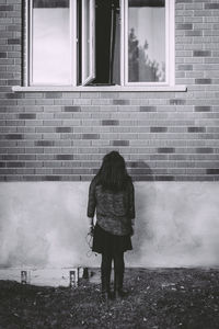 Woman standing in front of building