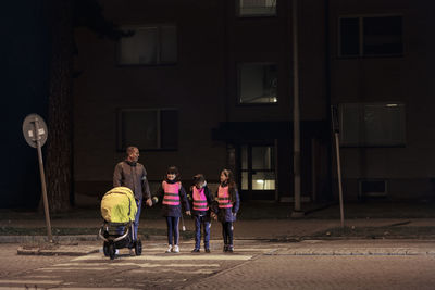 Father with children walking at evening