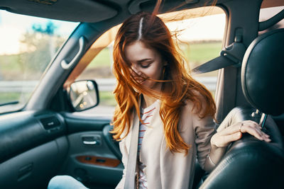 Woman sitting in car