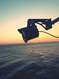 Scenic view of sea against clear sky during sunset