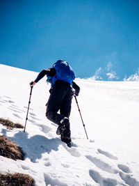 Low angle view of person skiing on snow