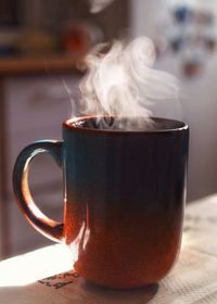 Close-up of fresh black coffee on table