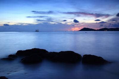 Scenic view of sea against romantic sky at dusk