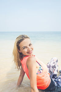 Woman enjoying at beach during summer