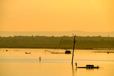 Scenic view of lake during sunset