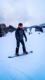 Full length of man skiing on snow
