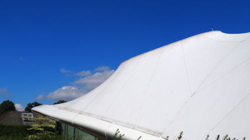 Low angle view of built structure against blue sky