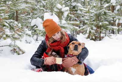 View of dog on snow covered landscape during winter