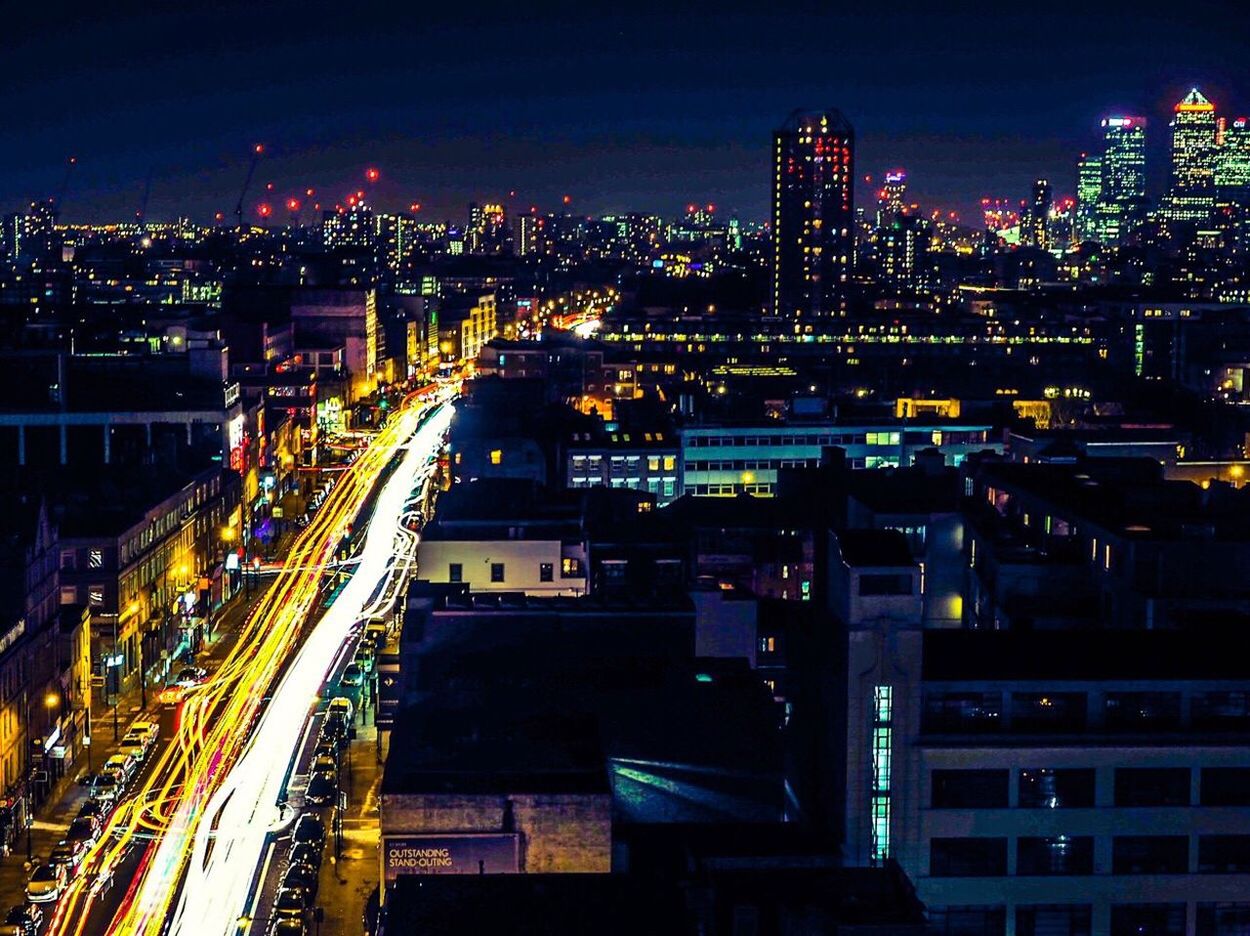 HIGH ANGLE VIEW OF ILLUMINATED CITYSCAPE