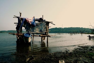 Fishing net in sea against clear sky