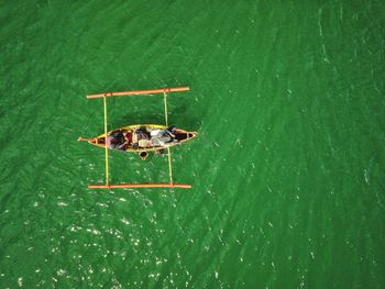 High angle view of people in boat on sea