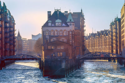 View of bridge over canal in city