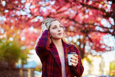 Young woman standing in park