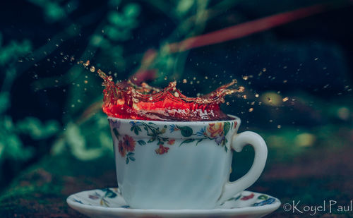 Close-up of coffee cup on table