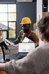 Side view of man working in office