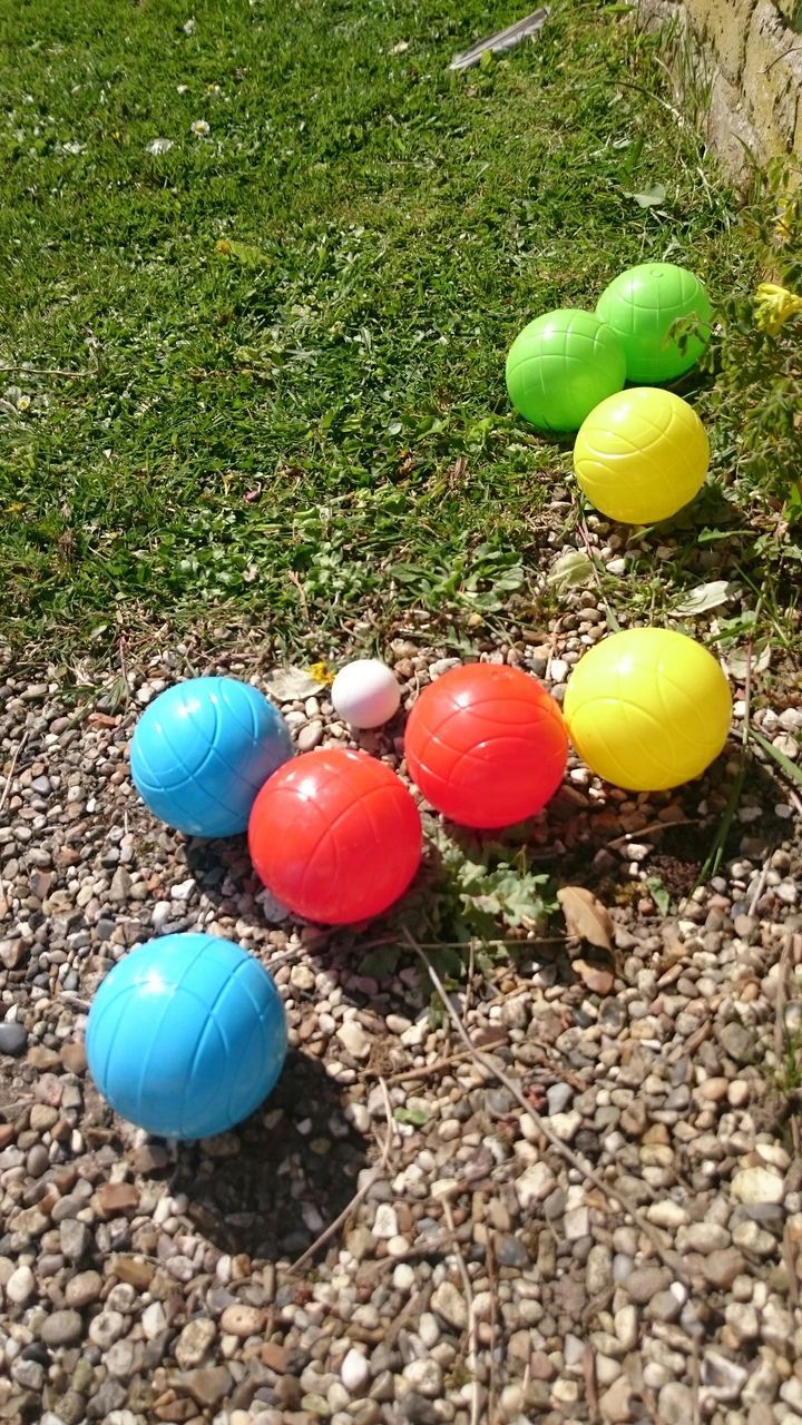 CLOSE-UP OF COLORFUL PIPES ON THE GROUND