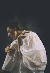 Woman with old white embroidered cloak