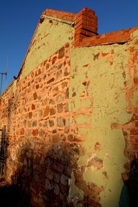 Low angle view of old ruins against sky