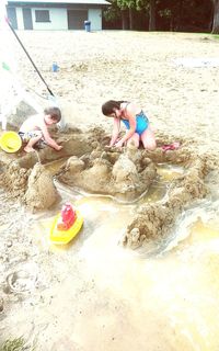 Children playing with toy on beach