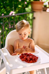 Girl sitting on table