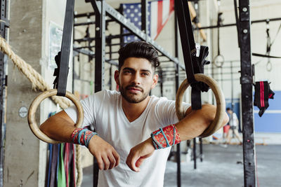 Portrait of young man standing outdoors