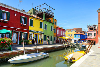 Boats moored at harbor