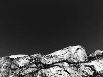 Close-up of rock formation against clear sky