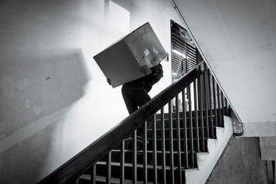 Low angle view of man standing on staircase