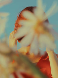 Close-up of woman against blurred background