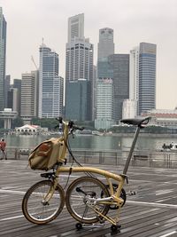 Bicycles on street against buildings in city