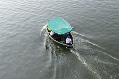 Rear view of man in boat