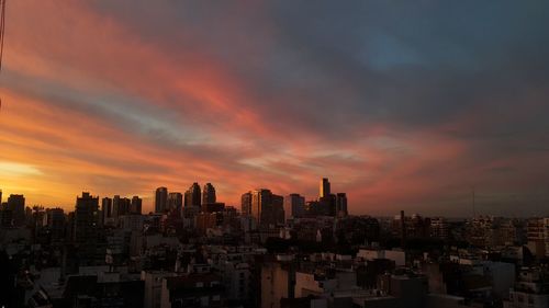 Cityscape against sky during sunset