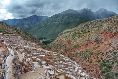 High angle view of mountain range against cloudy sky