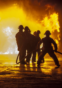 Firefighters extinguishing fire