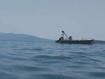 Ship in sea against clear sky