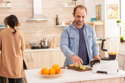 Man preparing food on table at home