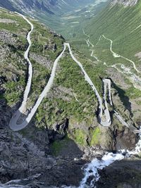 High angle view of road amidst mountains