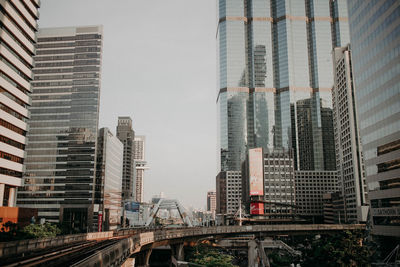 Modern buildings against sky in city