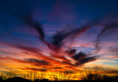 Low angle view of dramatic sky during sunset