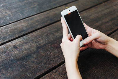 Close-up of hand holding mobile phone