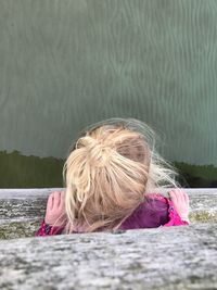 High angle view of girl looking at lake