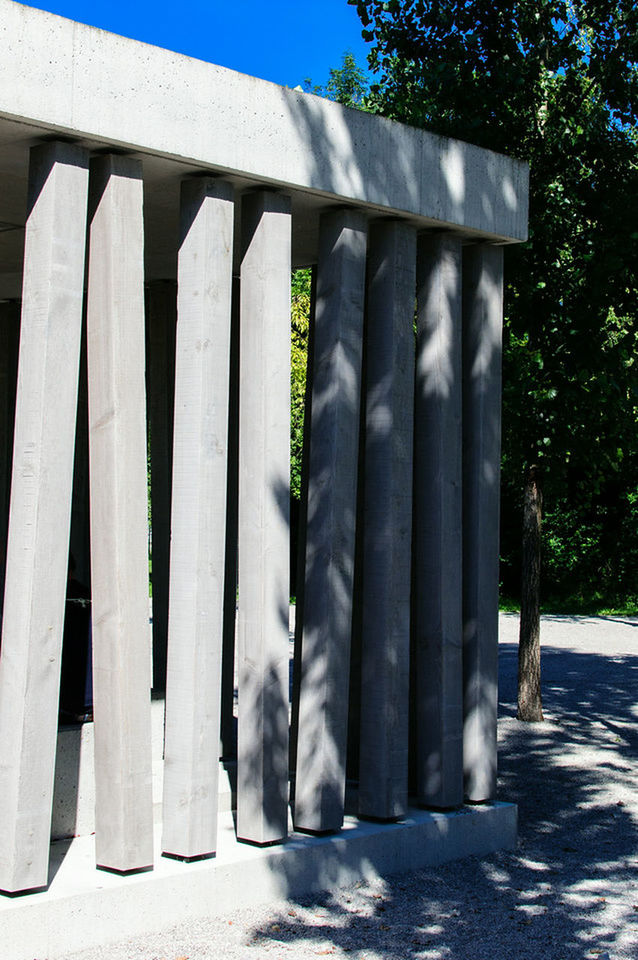 architecture, built structure, architectural column, column, building exterior, low angle view, in a row, sunlight, shadow, day, white color, outdoors, no people, sky, tree, railing, colonnade, pillar, blue, sunny