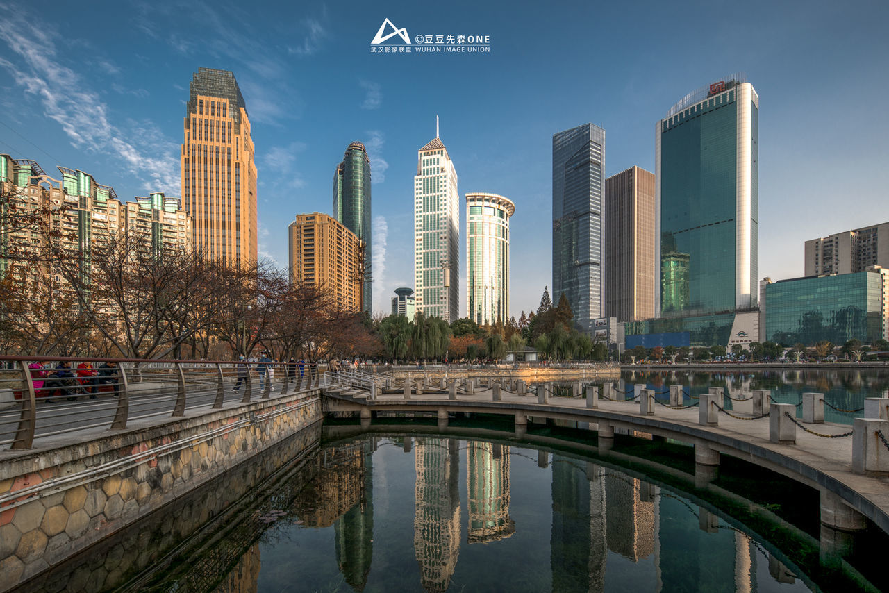 This is China City Cityscape Urban Skyline Water Modern Illuminated Skyscraper Panoramic Tree Bridge - Man Made Structure