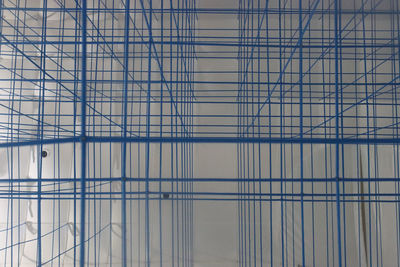 Low angle view of glass window in modern building