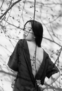 Chinese girl among the shadows of a tree