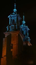 Low angle view of bell tower at night