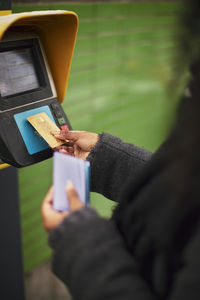 Woman paying for ticket with credit card