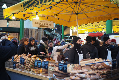 People at market stall