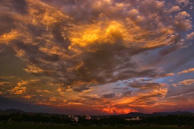 Scenic view of landscape against cloudy sky