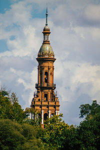 Low angle view of clock tower against sky